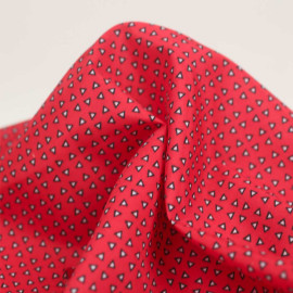 Tissu maillot de bain homme rouge à motif petit triangle blanc et noir